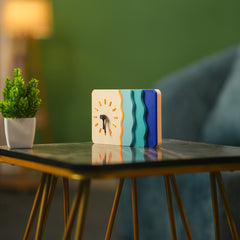 Colorful clock on a table with a blurred background