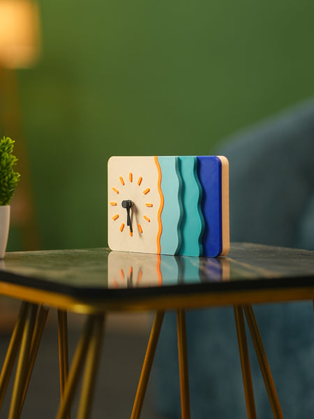 Colorful clock on a table with a blurred background