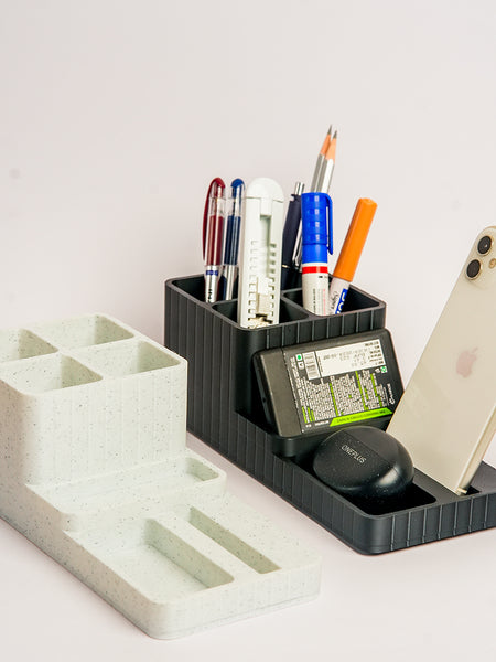 Desk organizer with stationery items on a white background