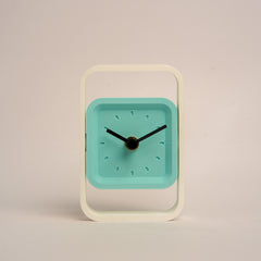 Compact SpinFrame teal and white desk clock for stylish interiors