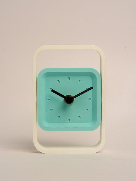 Compact SpinFrame teal and white desk clock for stylish interiors