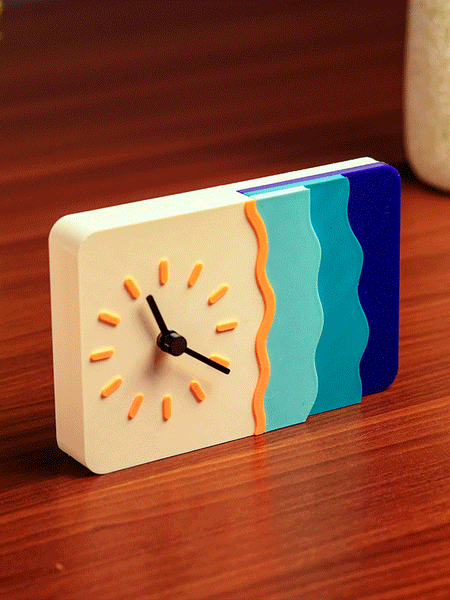 LayerStory “Waveform Horizon” Desk Clock with wave-inspired design and sunburst dial.