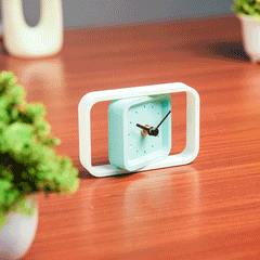 Compact SpinFrame teal and white desk clock for stylish interiors