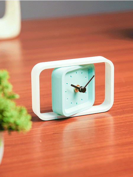 Compact SpinFrame teal and white desk clock for stylish interiors