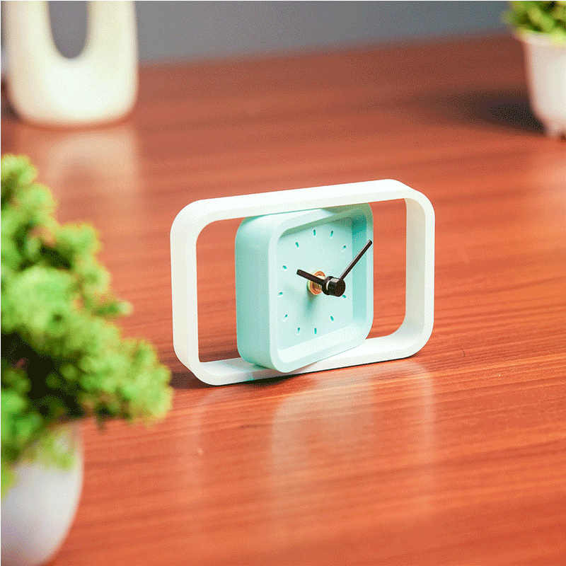 Compact SpinFrame teal and white desk clock for stylish interiors