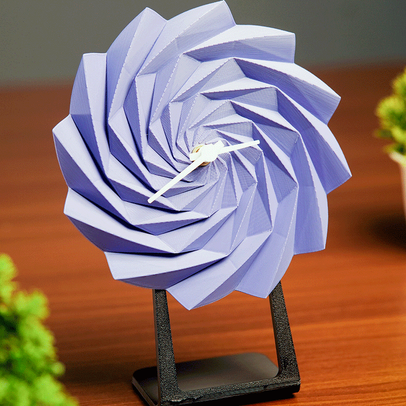 LayerStory Twist Bloom Desk Clock in purple with geometric swirl design